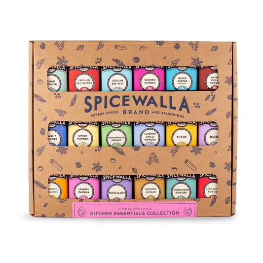 Spicewalla Kitchen Essentials kraft box with 18 colorful spice tins in three rows