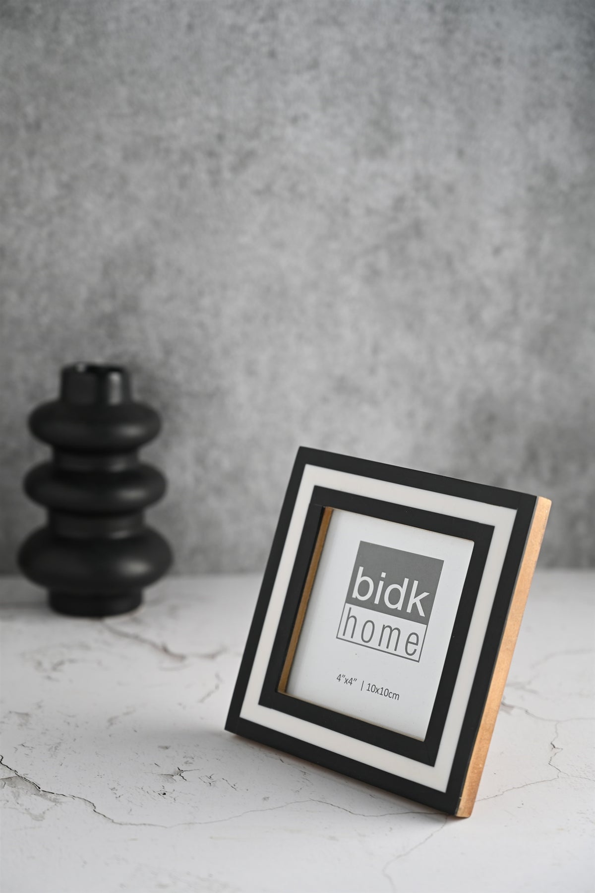 Line Frame, Black & White by BIDKhome — 4 × 4 on a shelf