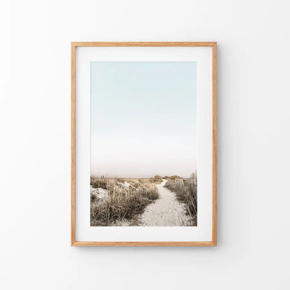 Sand path through dune grass, framed in thin oak with a mat