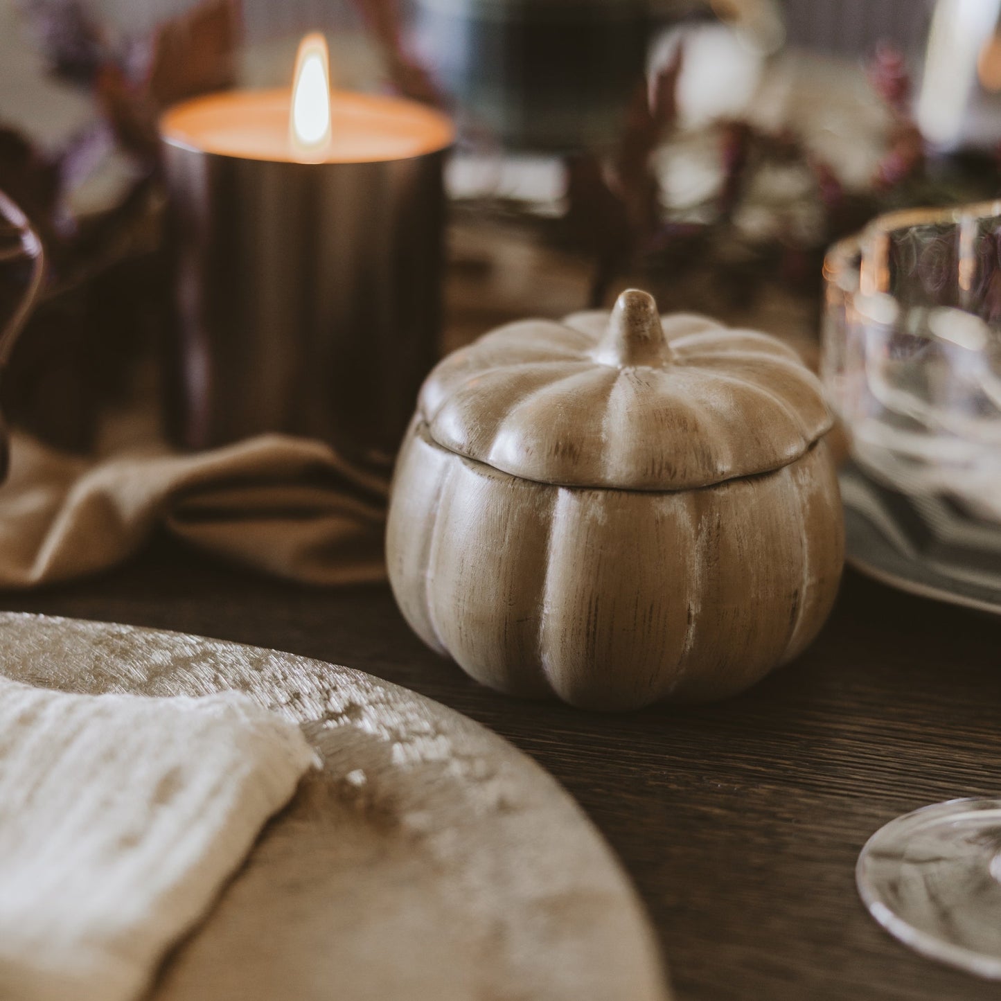 Pumpkin spice candle styled on a fall table
