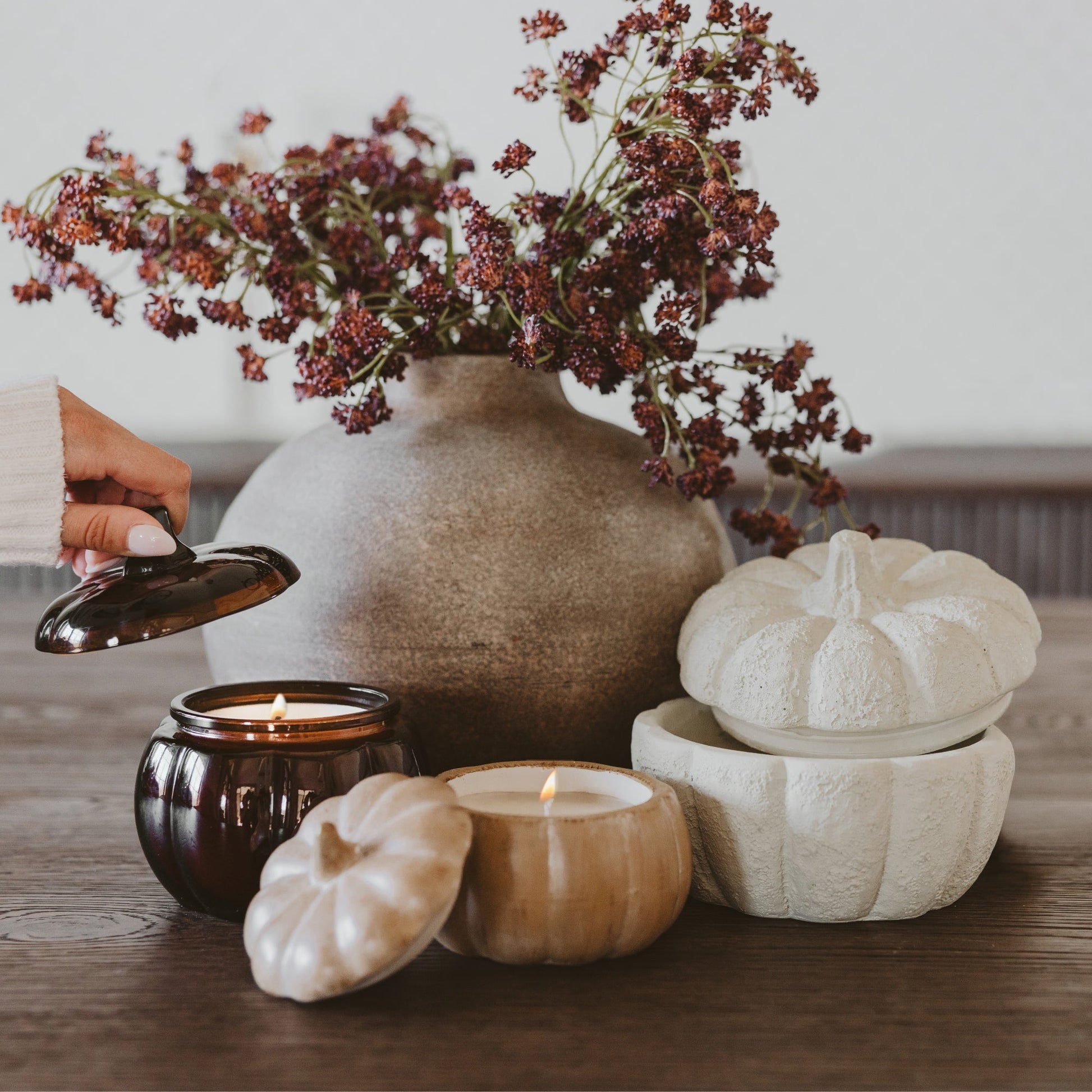 Pumpkin jar candles styled as a fall collection