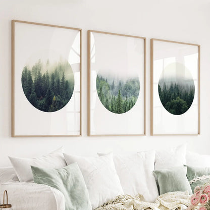 Set of three misty forest circle prints in wood frames above a light sofa