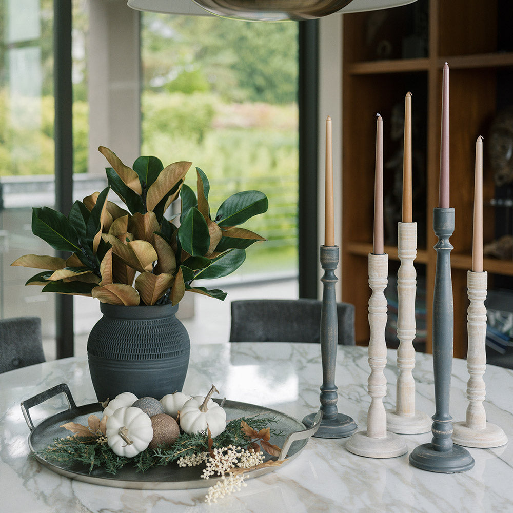 Wooden candlesticks, a round tray and dark vases