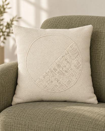 Kazuki Woven Circle Pillow styled on a green upholstered chair