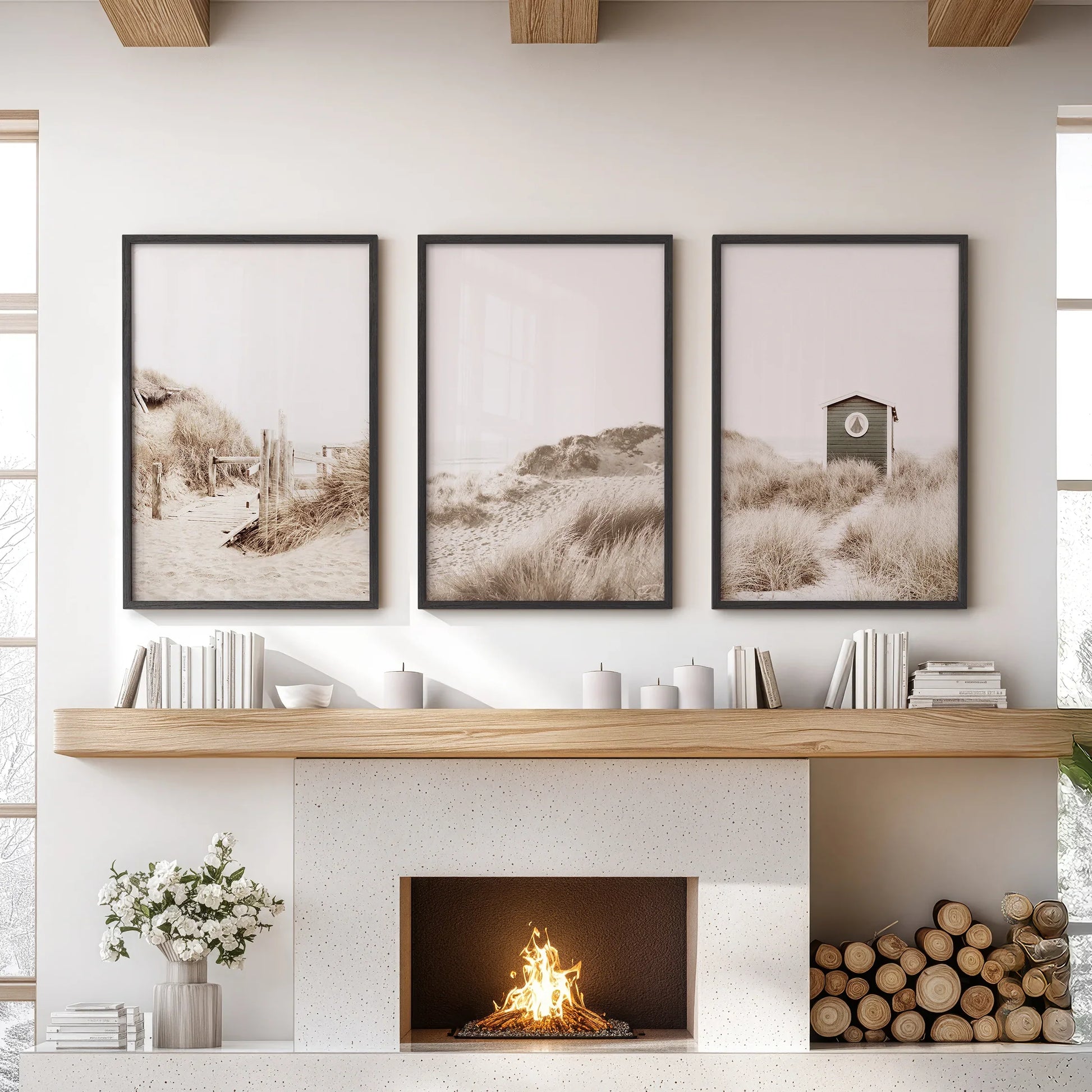 Neutral coastal print trio in black frames above a mantel