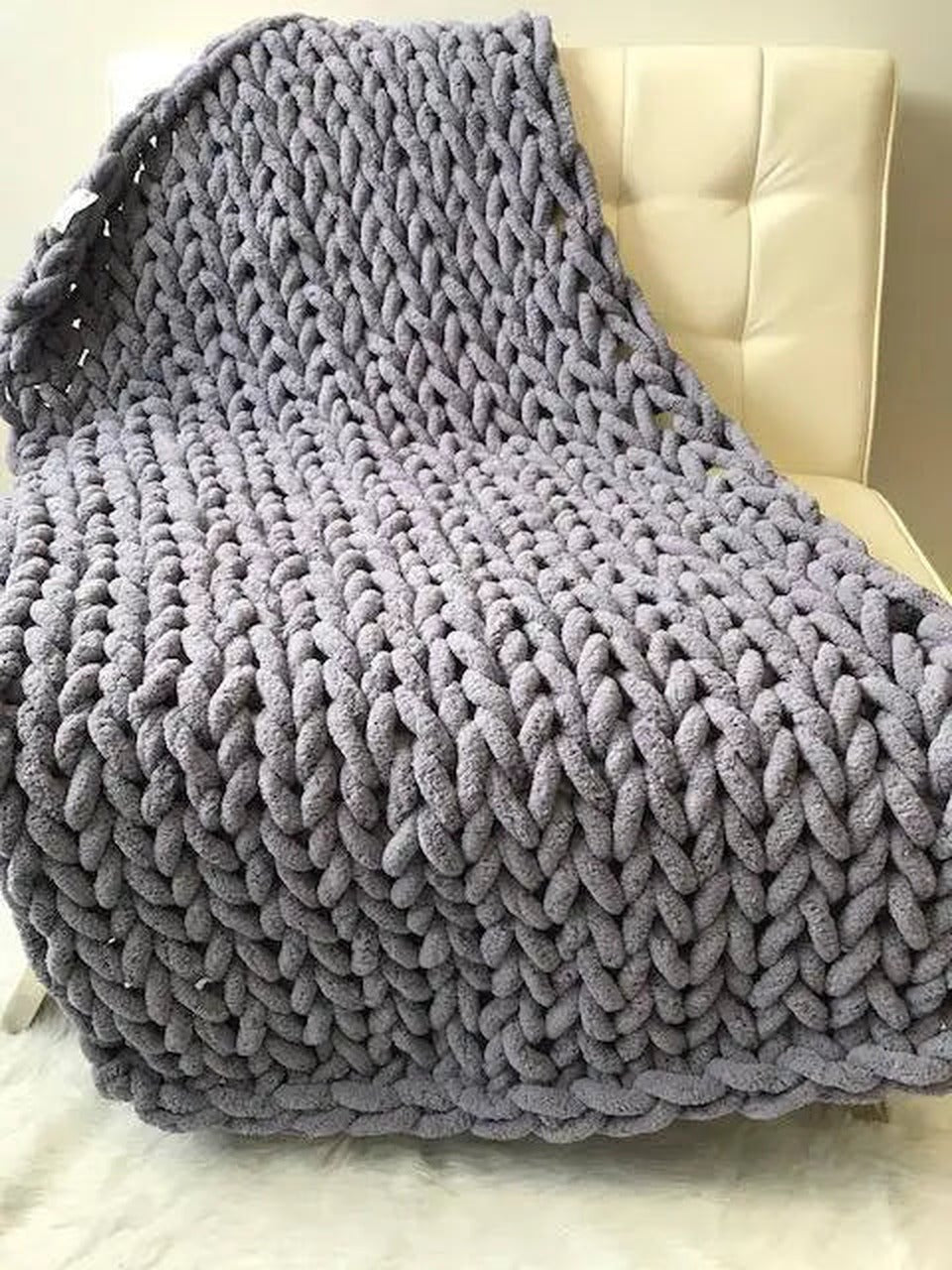 Chenille knit throw blanket draped, detail of woven texture