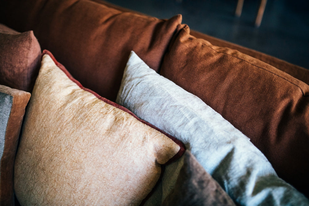 Pomax cushions and soft layers styled in an interior
